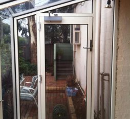 Aluminium Commercial Door In Hooded Garden Window